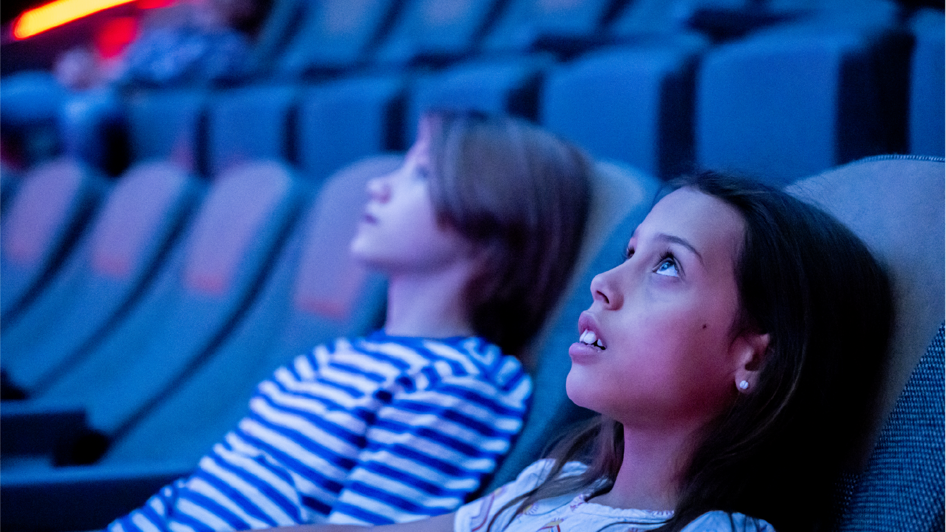 Kids looking up into the Planetarium